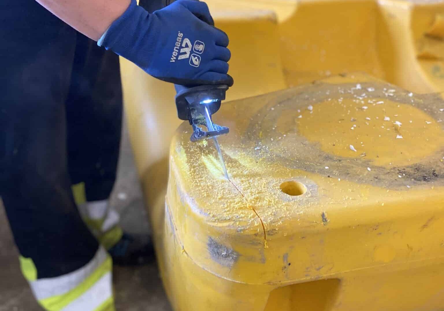 Plastic buoy cut open for plastic recycling